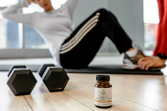black dumbells and white-labeled bottle