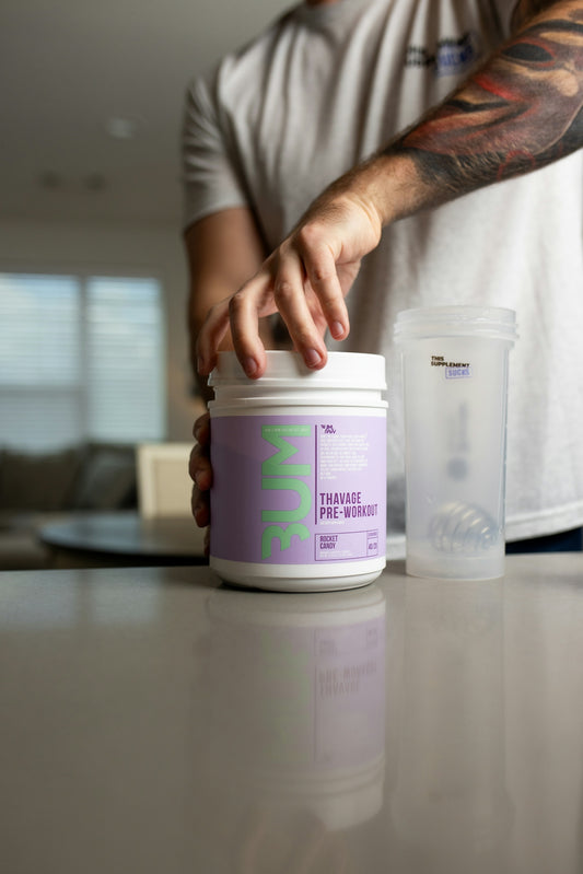 a man with a tattoo on his arm is putting a container on a counter